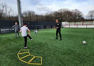 2 boys with a coach