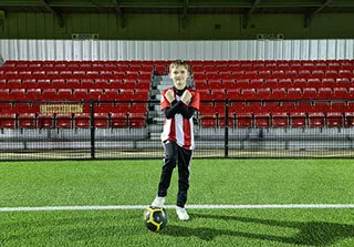 boy with southampton shirt