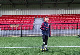 boy with red and blue top
