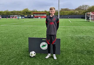 boy with liverpool kit